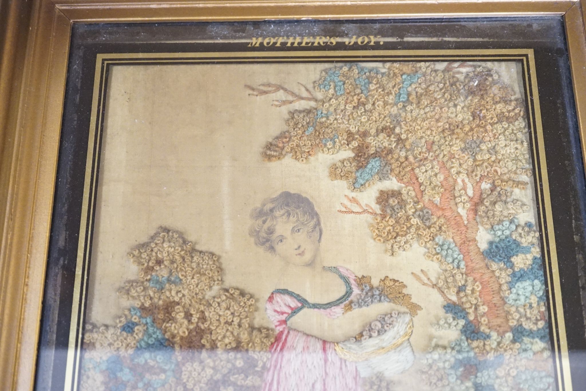 A Regency woolwork picture, entitled Mother’s Joy, named Miss Mary Francks and dated 1819, 30 x 22cm